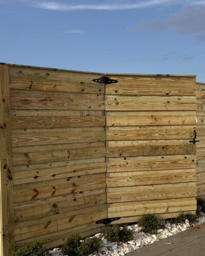 Horizontal wood privacy fence with a matching walk gate